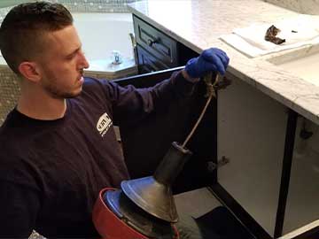 Drain rooter services.