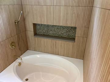 Bathtub installation for bathroom remodeling project.
